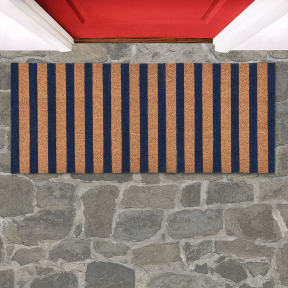 Striped doormat with navy and tan vertical stripes, rectangular.