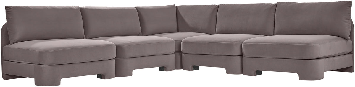 Taupe armless velvet sectional sofa with deep seats and padded back cushions.