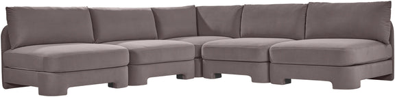 Taupe armless velvet sectional sofa with deep seats and padded back cushions.
