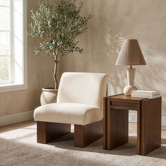 Velvet performance accent chair with light cream upholstery and flared armrests