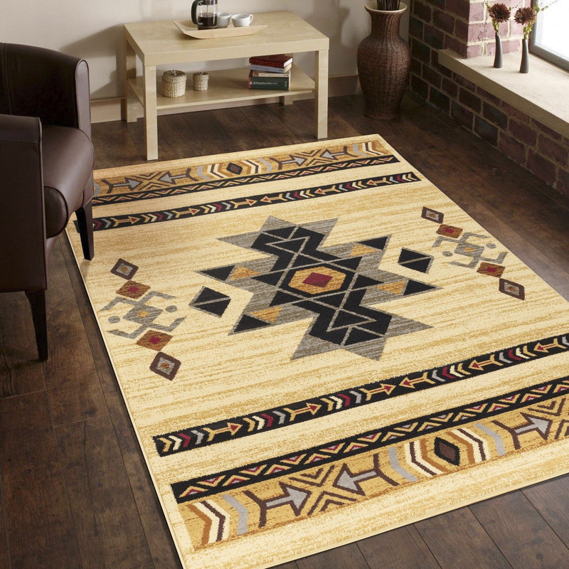 Beige geometric area rug with large central starburst and multicolor border stripe