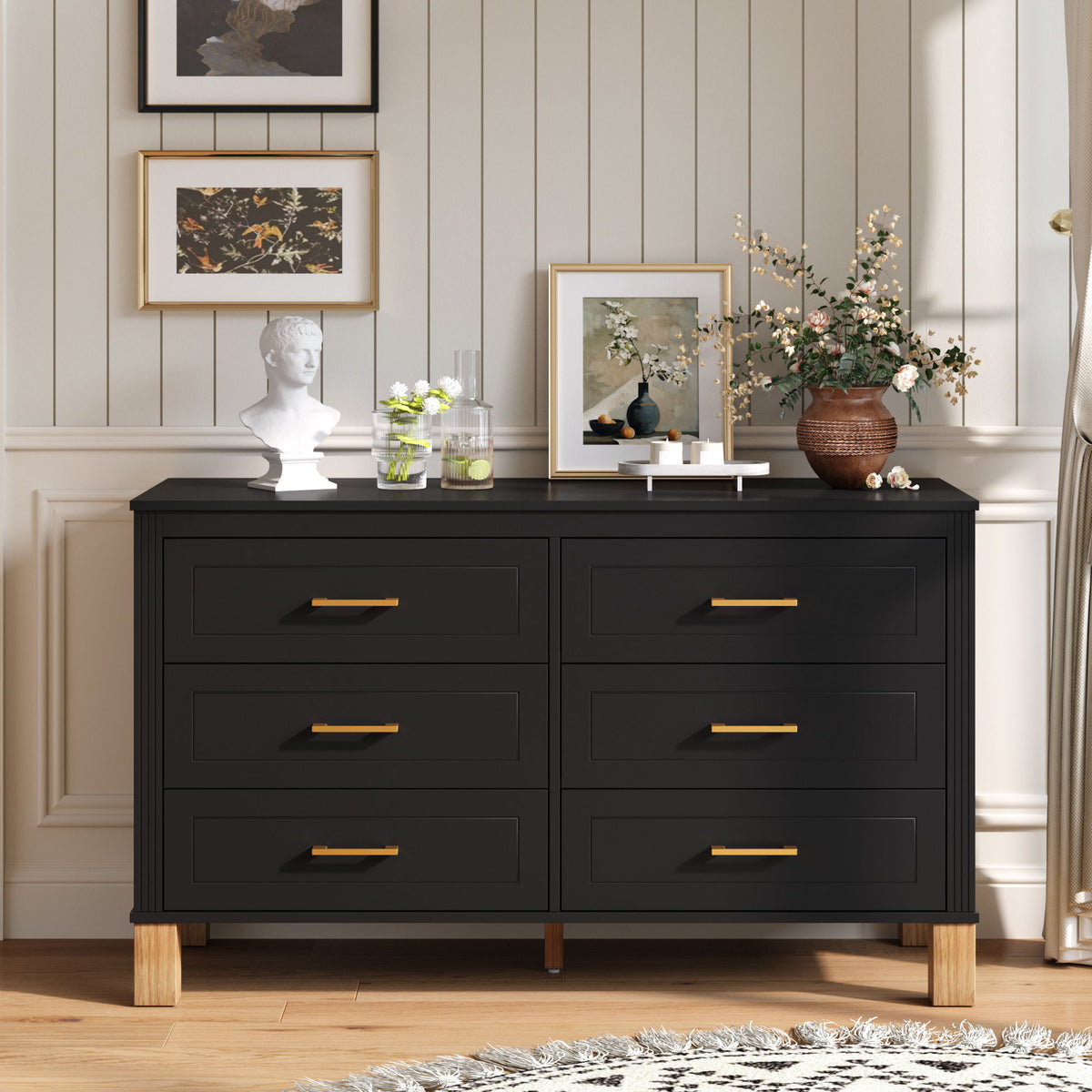 Black double dresser cabinet with six drawers and gold-tone bar pulls.