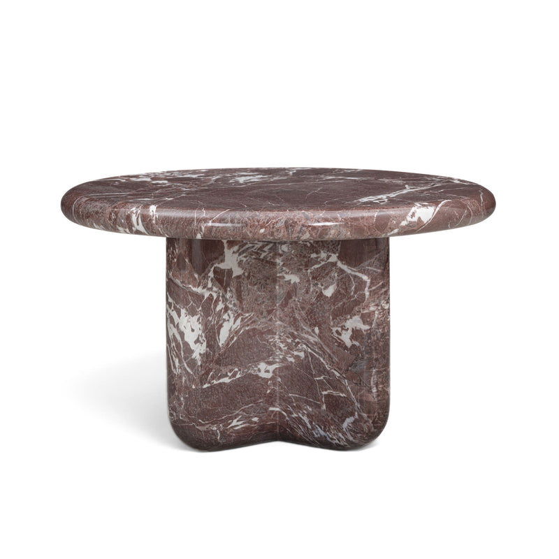 Round dark red marble-look coffee table with white veining and cylindrical pedestal