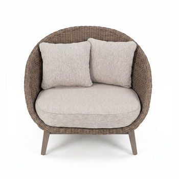 Woven lounge chair with beige seat cushion and two back cushions