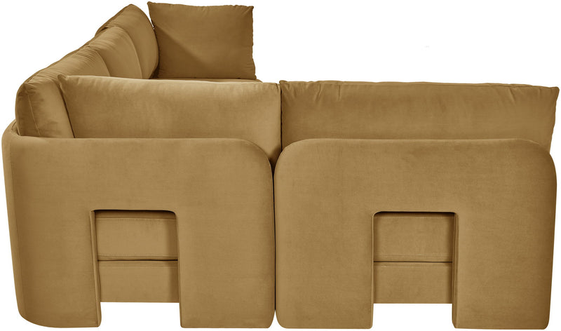 Tan velvet armless sectional sofa, close-up view of rounded arm and inner panel