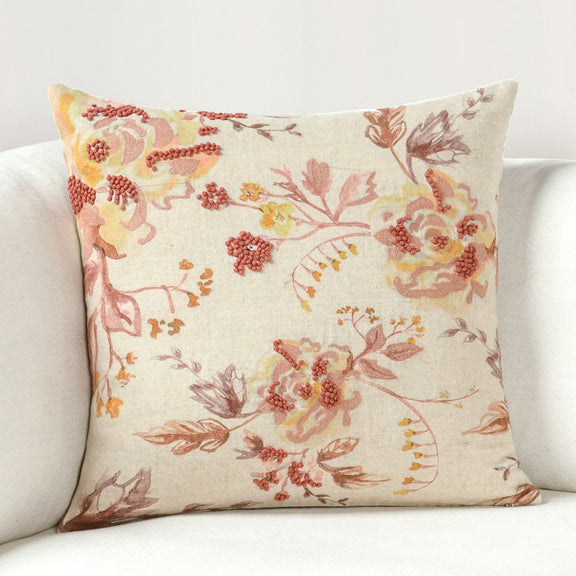 20x20 decorative pillow on sofa, cream floral print with rust and gold accents