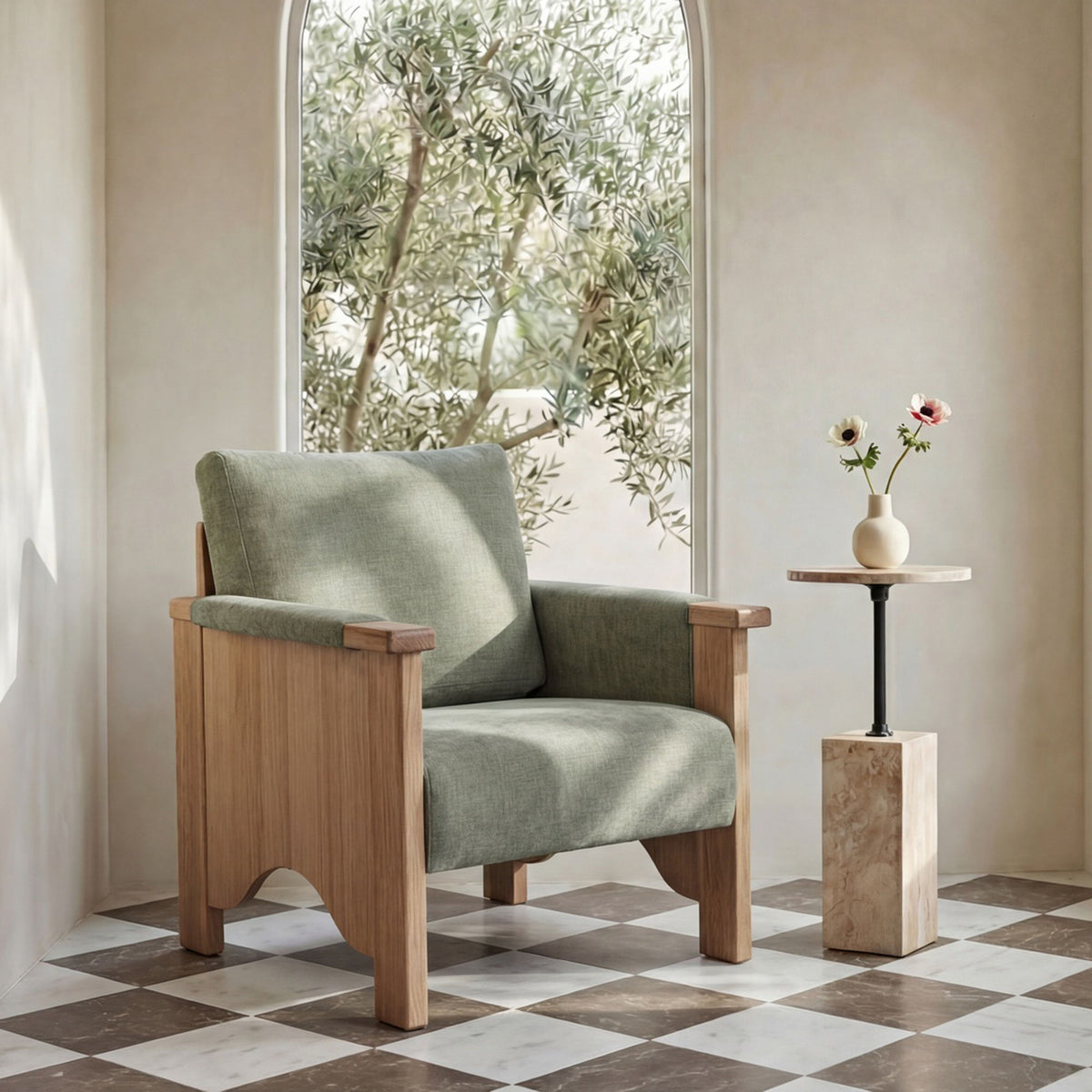 Sage green upholstered accent chair with light brown wood frame and wide arms.