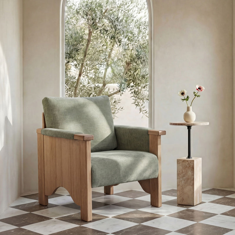 Sage green upholstered accent chair with light brown wood frame and wide arms.