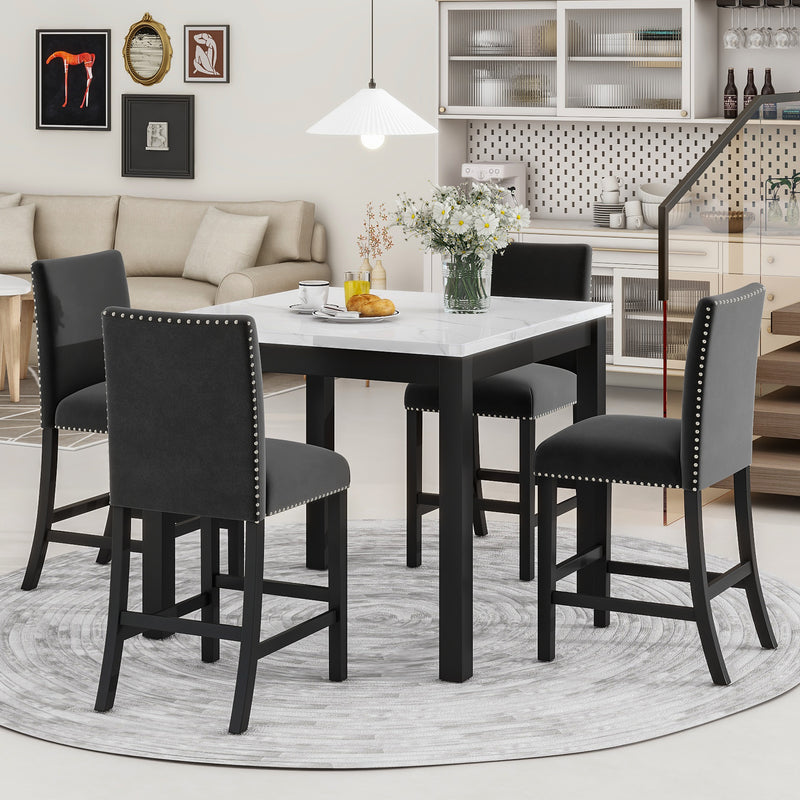 Counter-height dining table set with faux marble top and four black upholstered chairs