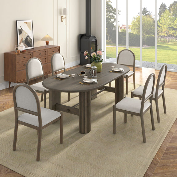 Dark brown oval dining table with six upholstered chairs, side view, fabric seats