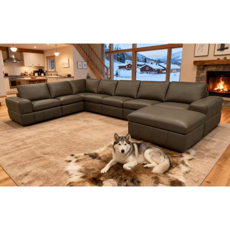 Dark green modular sectional sofa with square arms and ottoman chaise, deep seat cushions