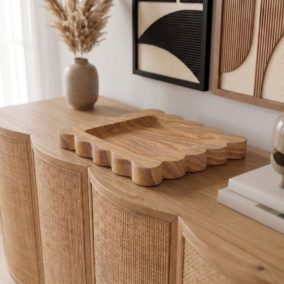 Sandstone wooden tray on cabinet with scalloped edges and striped wood grain