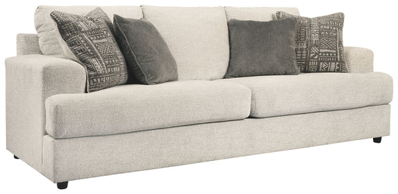 Stone queen-size sofa sleeper with square arms and patterned throw pillows