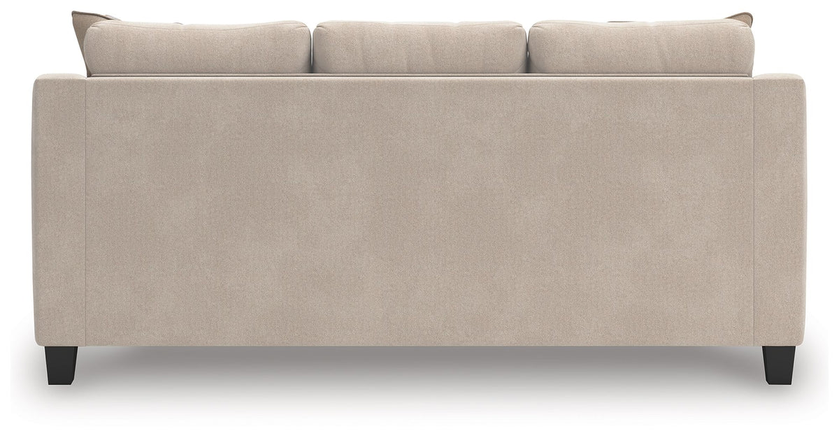 Taupe upholstered sofa back with three seatback sections and dark legs