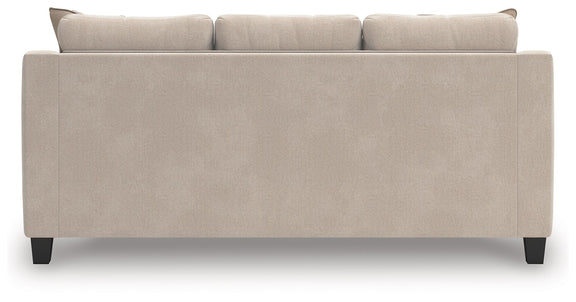 Taupe upholstered sofa back with three seatback sections and dark legs