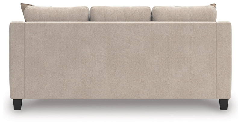 Taupe upholstered sofa back with three seatback sections and dark legs