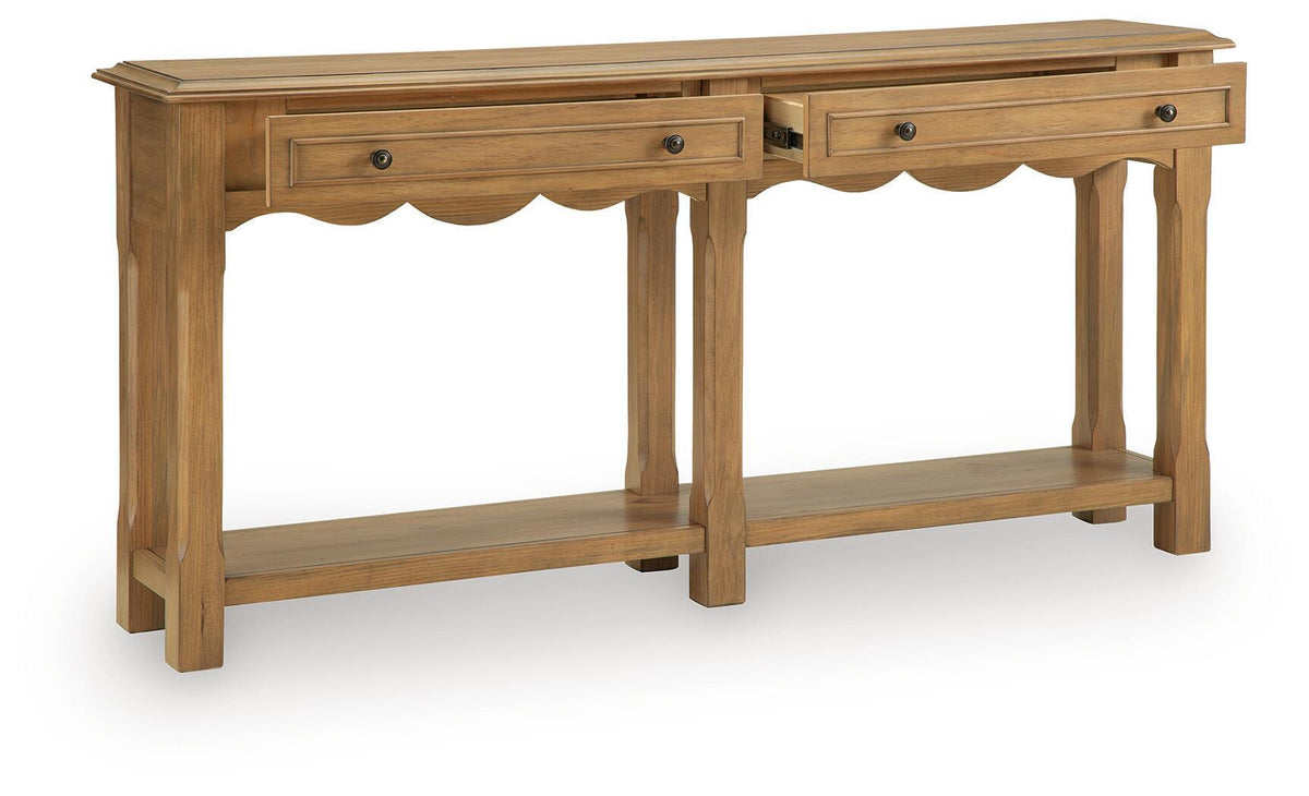 Light brown console sofa table with scalloped apron, two drawers, and open shelves