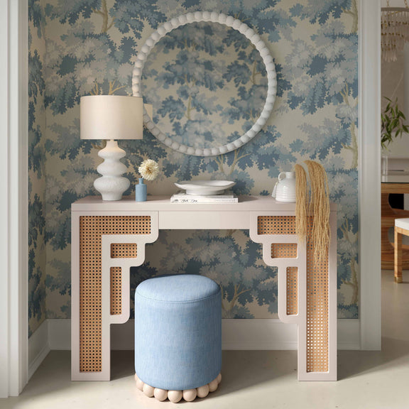 Light blue upholstered fabric ottoman with wooden ball base