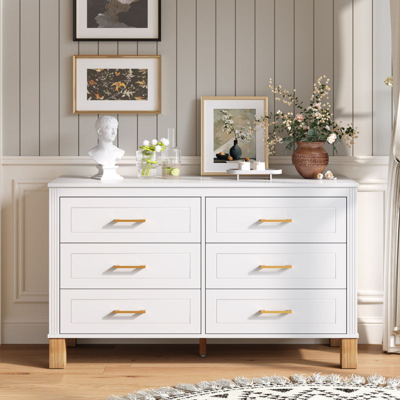 White double dresser cabinet with six drawers and gold-tone bar pulls.