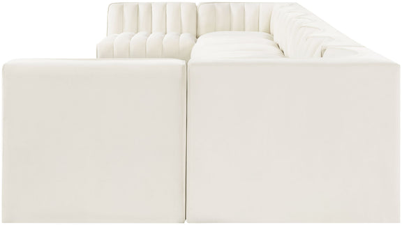 White armless velvet sectional corner unit with deep seats and tufted back cushions