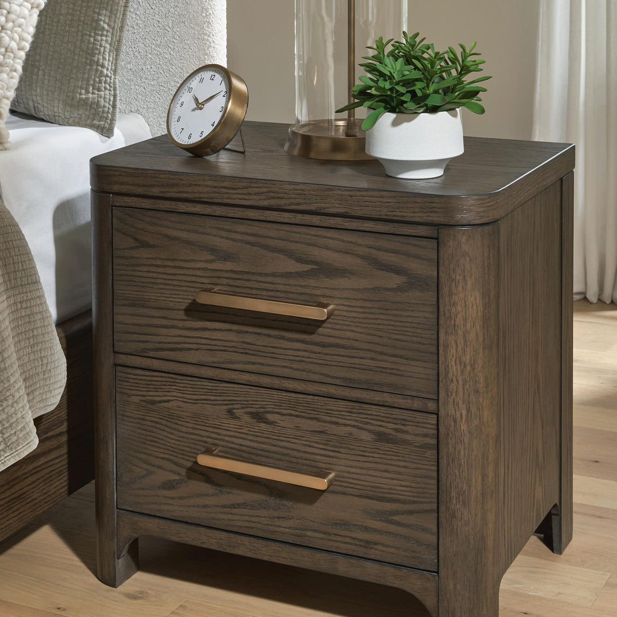 Radkin - Two Drawer Night Stand - Burnished Brown