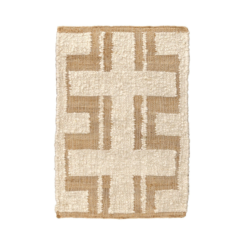 Ivory area rug with tan geometric cross pattern and short loop pile texture
