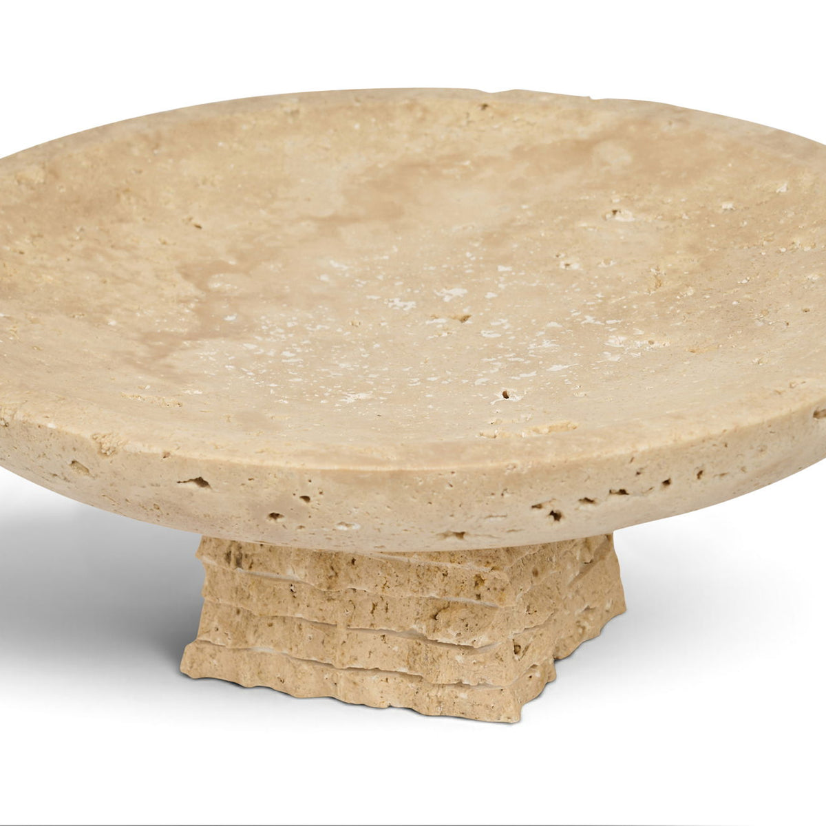 Beige travertine bowl with wide round rim and sculpted pedestal base
