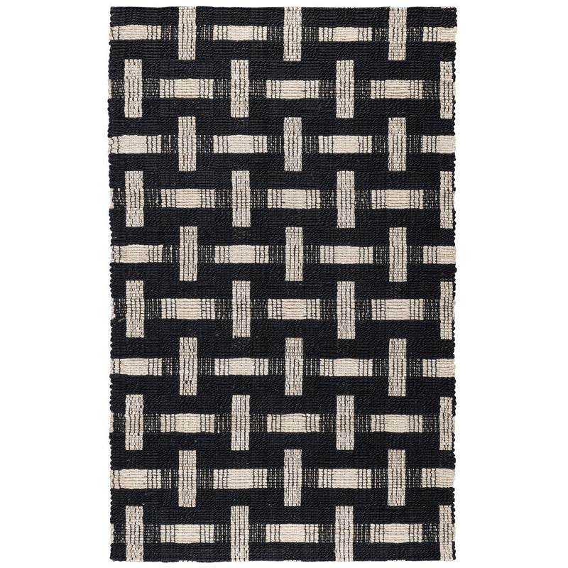 Dark charcoal and ivory geometric block rug with repeating interlocking pattern