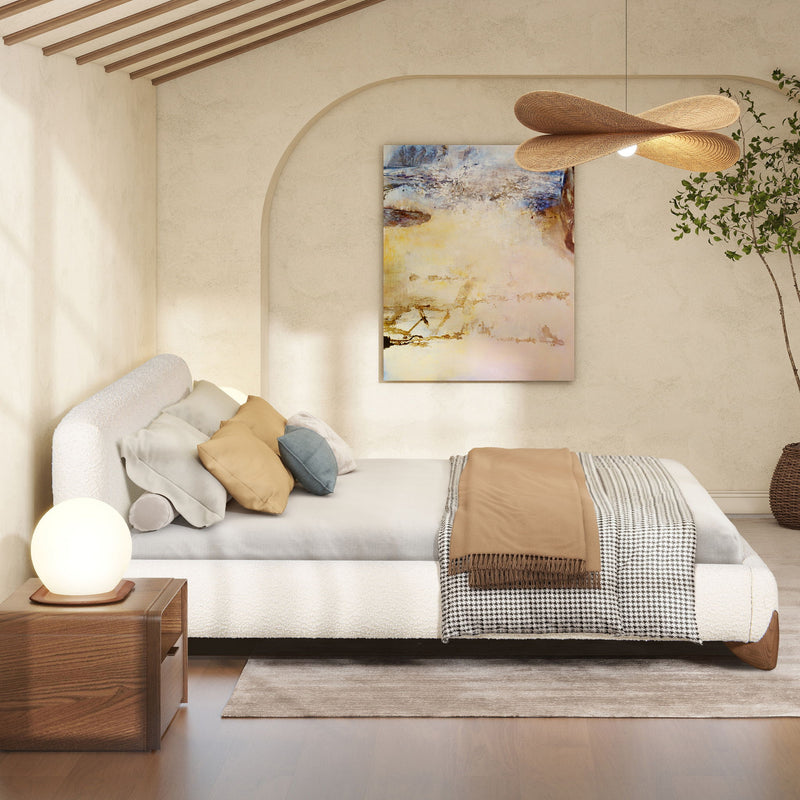 Modern upholstered platform bed in white with curved headboard and slatted base