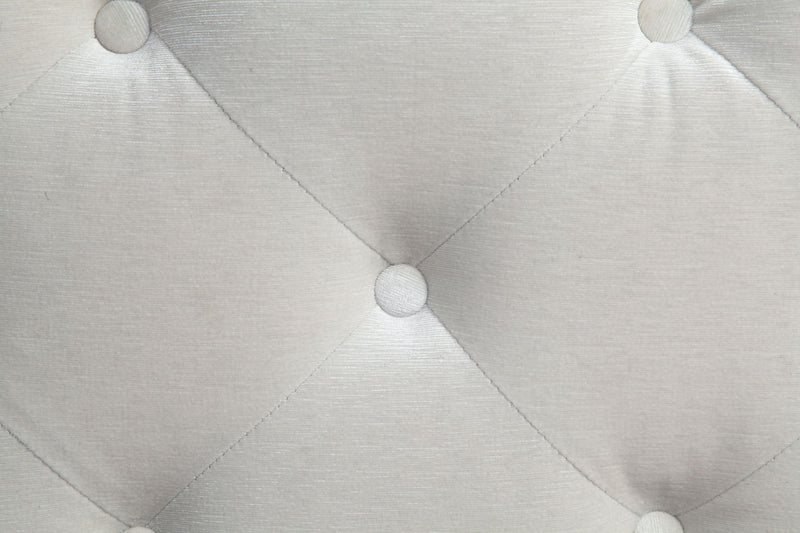 Beige tufted upholstery with diamond quilting and round button details