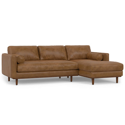 Dark brown upholstered sectional sofa with rounded back cushions and right chaise