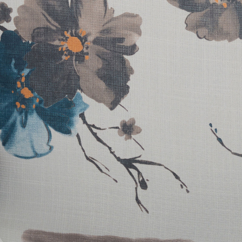 Close-up of white upholstered fabric with blue floral and leaf pattern