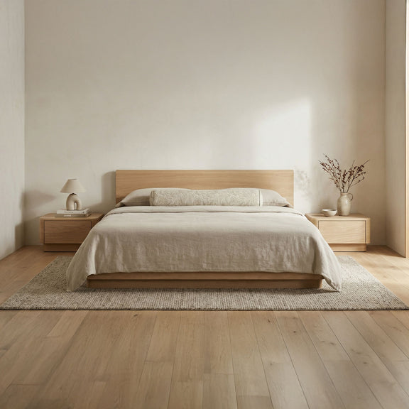 Natural oak king bed with low panel headboard, beige bedding set