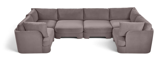 Gray velvet U-shaped sectional sofa with thick back cushions and padded armrests