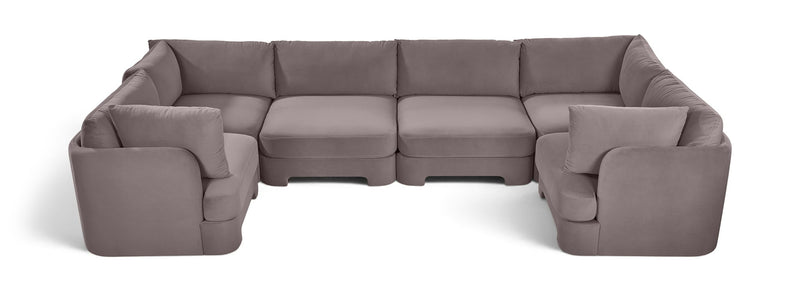 Gray velvet U-shaped sectional sofa with thick back cushions and padded armrests