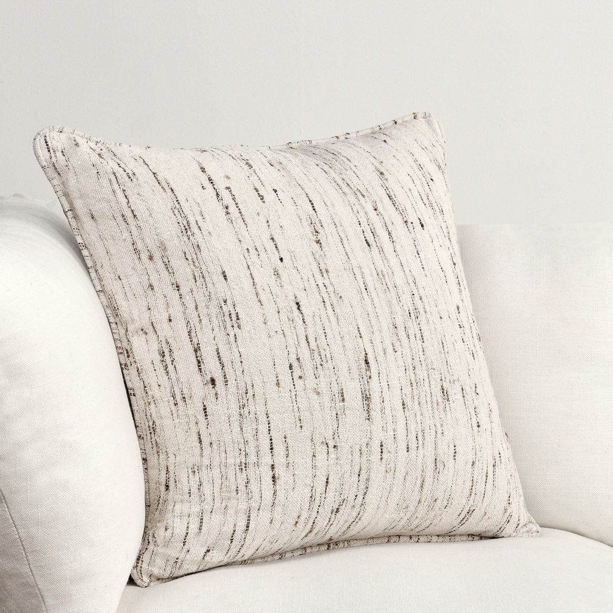 Decorative square pillow, natural off-white woven fabric with vertical speckled stripes