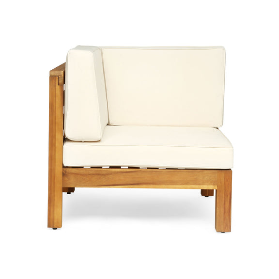 Outdoor love seat with cream cushions and light wood frame, side view
