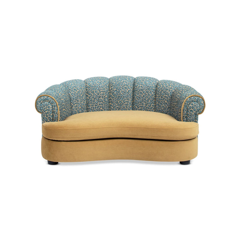 Rolled-arm dog sofa bed with blue patterned fabric and tan cushion base