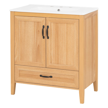 Light brown bathroom vanity with two cabinet doors and a drawer under a white top