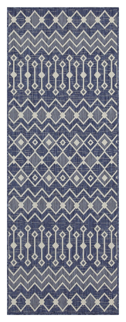 Indoor/outdoor polypropylene area rug, blue with light blue repeating diamond and stripe motifs.