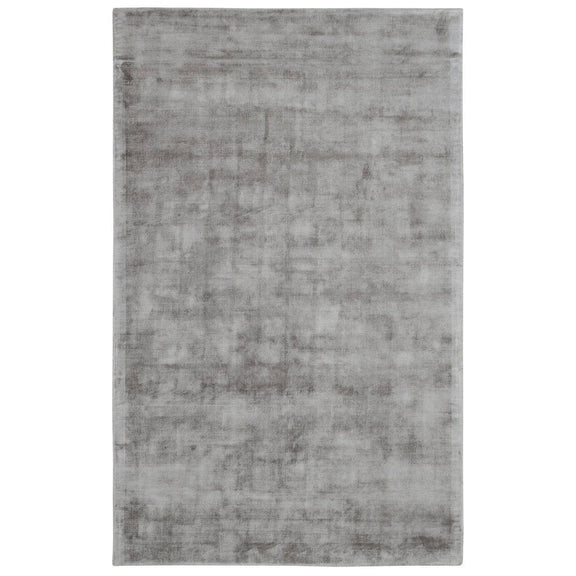 Medium light gray distressed area rug with mottled vintage pattern and flat pile.