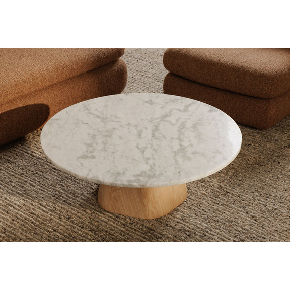 Round coffee table with ash grey veined top and light wood pedestal base