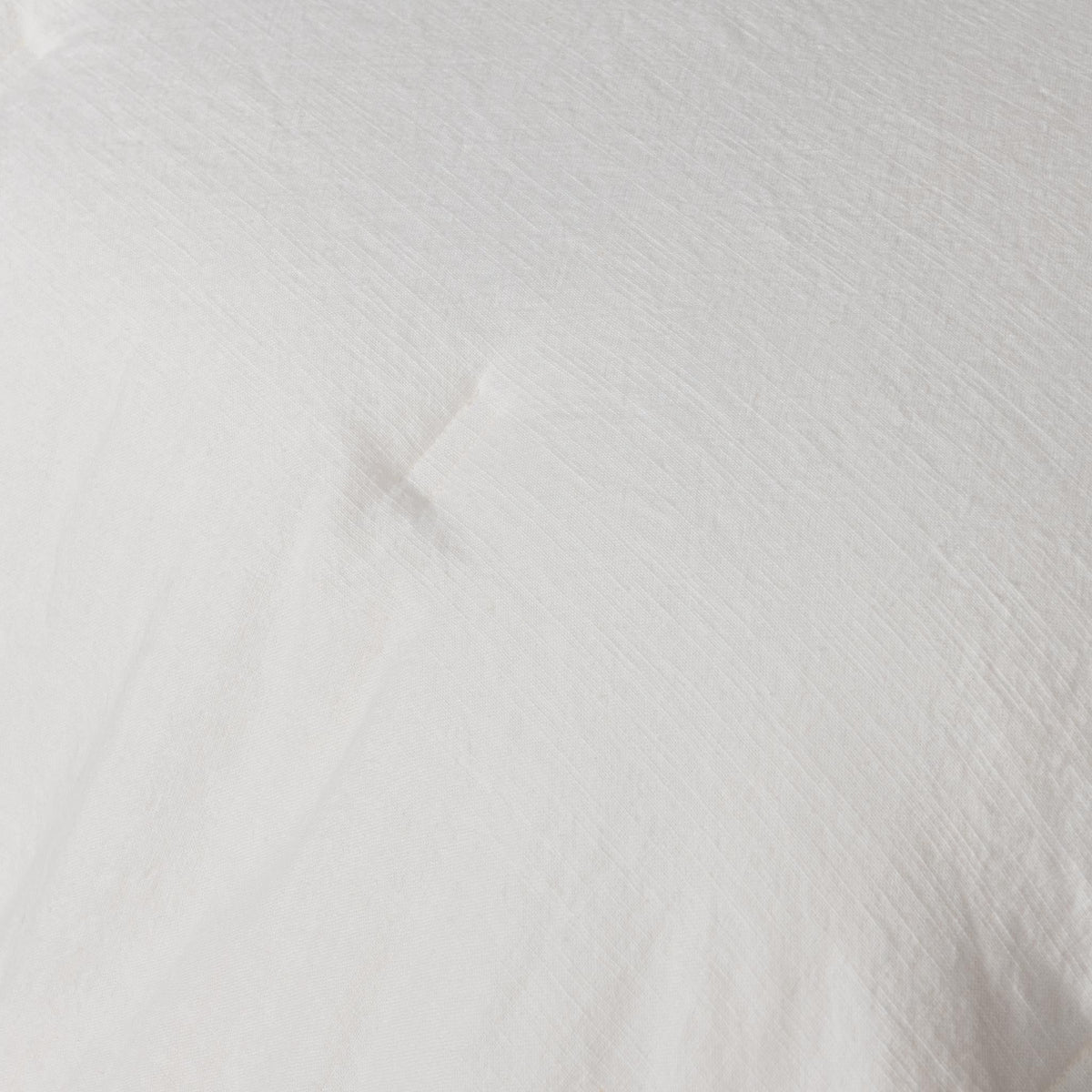 Cloud comforter sham fabric close-up, solid white textured weave