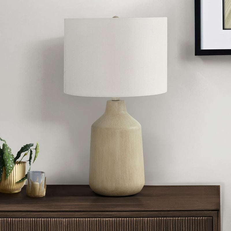 Beige concrete-style table lamp with white fabric drum shade