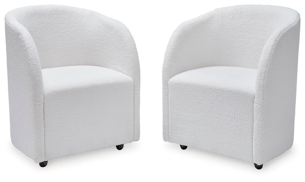 Set of 2 ivory upholstered dining armchairs with rounded backs, padded seats, and dark feet