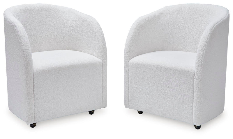 Set of 2 ivory upholstered dining armchairs with rounded backs, padded seats, and dark feet