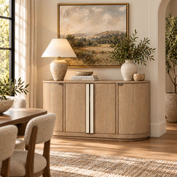 Beige wood server cabinet with four doors, silver strip handles, and curved base