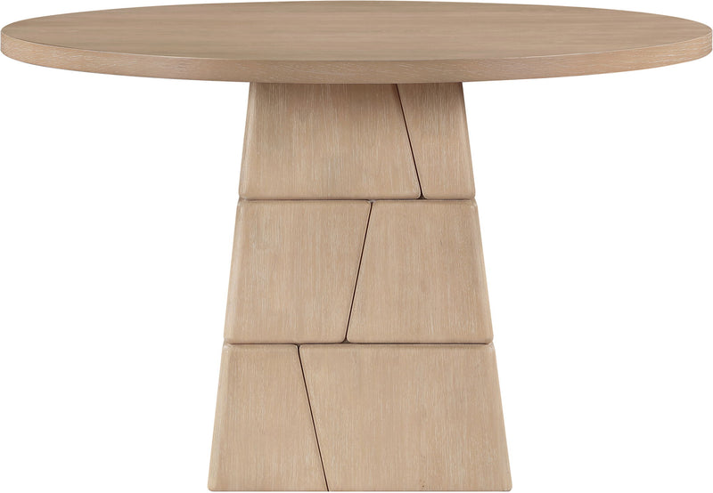 Light brown round dining table with stacked block pedestal base and wide tabletop