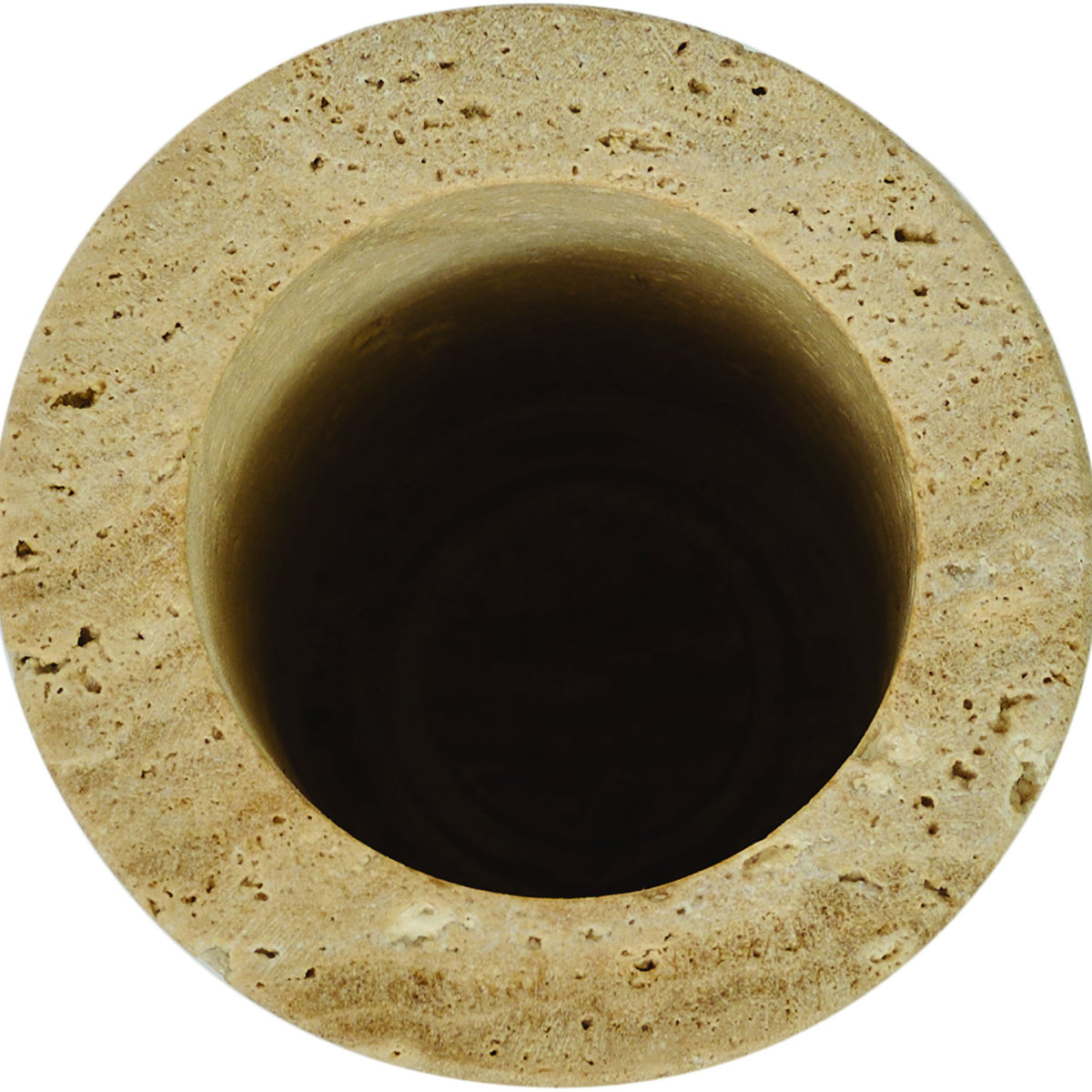 Beige travertine vase top view with dark interior opening