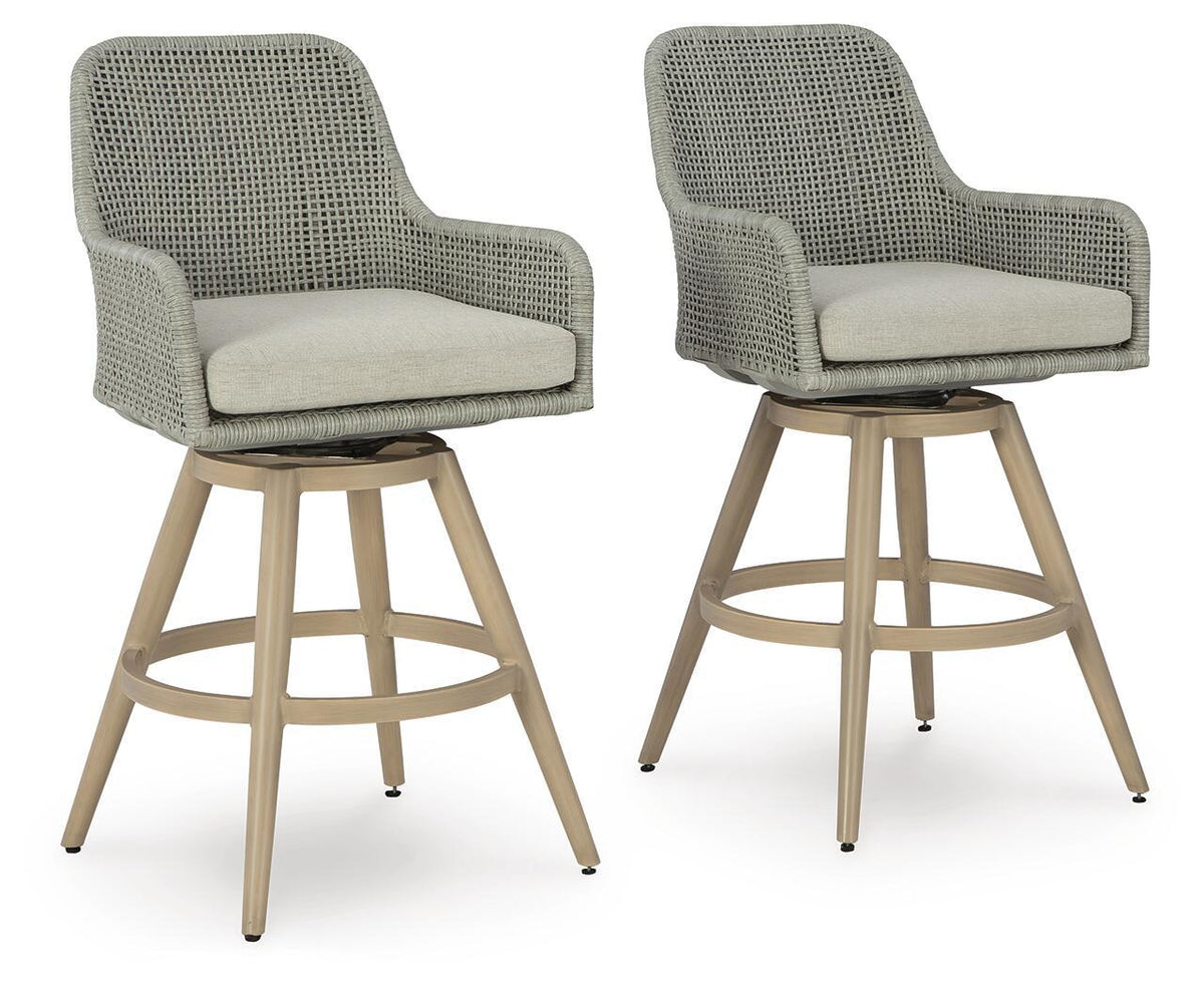 Pair of beige-gray woven barstools with seat cushions and light wood bases